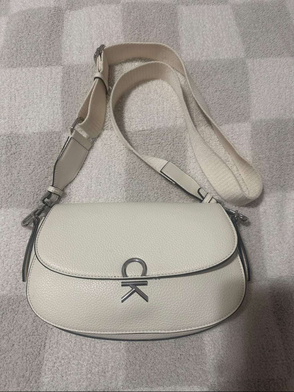 Calvin Klein Cream Pebbled Leather Crossbody Saddle Bag with Silver Logo